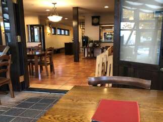 Step into this charming restaurant space, featuring a warm and inviting dining area with ample seating.