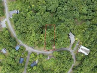 Discover this prime wooded lot, perfect for building your dream home amidst lush greenery.