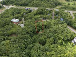 Discover this prime parcel of land nestled amidst lush greenery, offering a serene escape.
