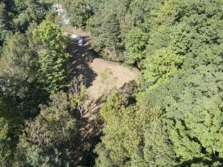 Discover this secluded wooded lot, perfect for building your dream home or a private retreat.