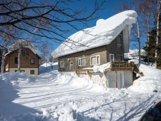 Experience the charm of a winter wonderland with this cozy home, perfectly situated to embrace heavy snowfall.