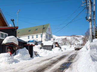 Experience the charm of a winter wonderland with this unique property nestled in a snow-covered village.