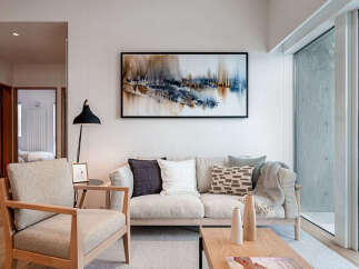 Experience modern living in this beautifully appointed living room, featuring a comfortable sofa and armchair perfect for relaxation.