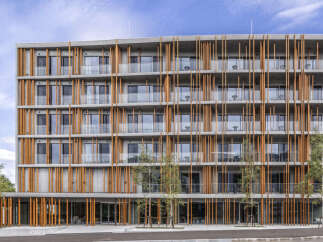 Discover modern living in this stunning multi-story building, featuring a unique facade of concrete and warm wooden vertical slats.