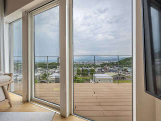 Experience breathtaking panoramic views from this stunning property, featuring expansive floor-to-ceiling windows that seamlessly blend indoor and outdoor living.