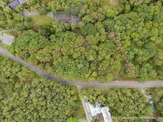 Discover this prime parcel of land nestled amidst lush greenery, offering a serene and private retreat.