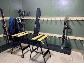 Maximize your storage with this versatile ski and snowboard rack system, perfect for organizing winter sports gear.