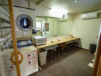 Discover a convenient and well-equipped laundry and dressing area, perfect for residents.