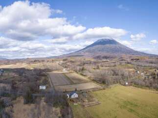 Discover this serene rural property with a majestic mountain backdrop, perfect for those seeking tranquility and space.