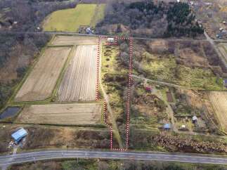 Discover this expansive rural property, perfect for agricultural pursuits or a private retreat.