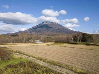 Discover this picturesque property nestled against the majestic backdrop of a snow-capped mountain.