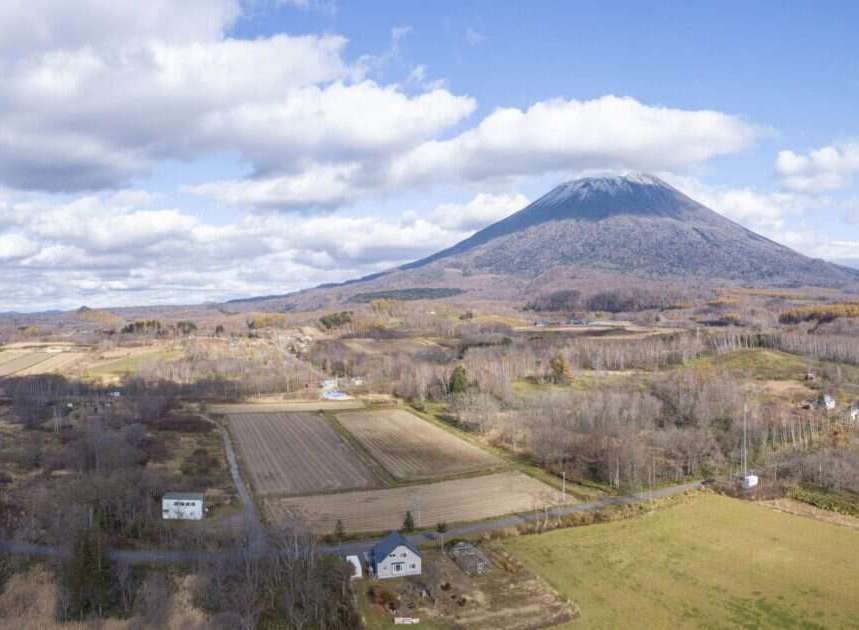 Discover this stunning property nestled in a serene rural landscape, offering breathtaking views of a majestic mountain.
