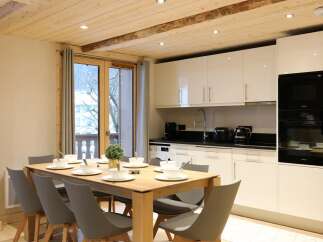 Experience modern mountain living in this beautifully appointed dining area and kitchen.
