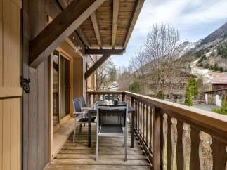 Enjoy breathtaking mountain views from this charming balcony, perfect for your morning coffee or evening relaxation.