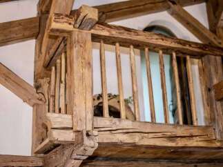 Experience rustic charm with this stunning exposed timber beam construction, showcasing intricate joinery and a natural, unfinished wood aesthetic.