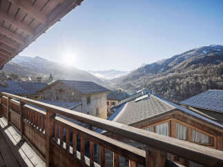 Experience breathtaking mountain views from this charming alpine property.