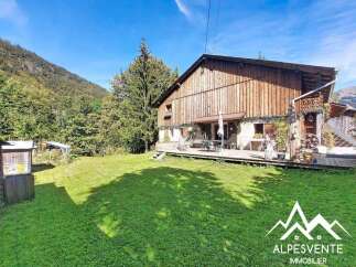 Discover this charming wooden chalet nestled in a serene mountain landscape, perfect for a tranquil getaway.