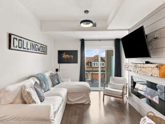 Experience modern comfort in this inviting living room, featuring a plush sectional sofa perfect for relaxation.