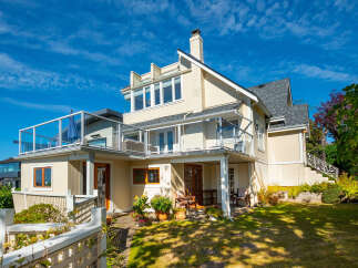 Experience coastal living in this stunning multi-level home featuring expansive glass balconies with breathtaking ocean views.