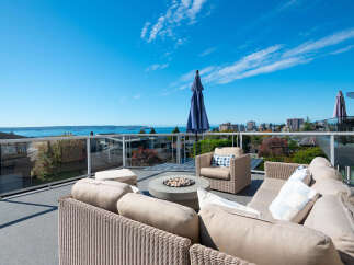 Enjoy breathtaking ocean and city views from this stunning rooftop patio, perfect for entertaining or relaxing.