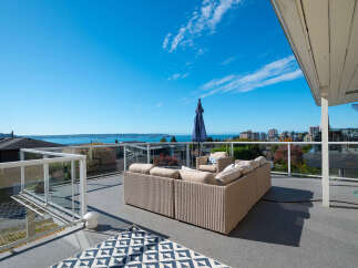 Enjoy breathtaking panoramic views from this expansive outdoor living space, perfect for entertaining or relaxing.