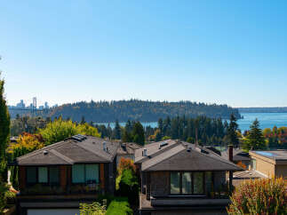 Experience breathtaking views from this stunning property, featuring a modern architectural design and lush landscaping.