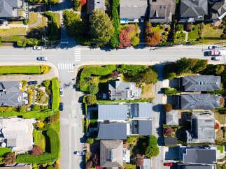 Experience luxury living in this stunning aerial view of a modern residential neighborhood.