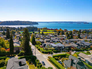 Experience breathtaking panoramic views of the ocean and city skyline from this stunning property.