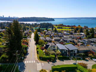 Discover this stunning residential neighborhood with beautiful homes and lush greenery, offering a serene and picturesque living environment.