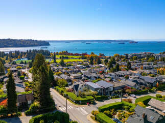 Experience breathtaking panoramic views of the ocean and surrounding mountains from this stunning property.