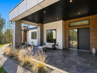 Experience modern luxury with this stunning home featuring a covered patio perfect for outdoor entertaining.