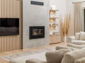 Experience modern living with this stunning living room featuring a sleek fireplace and integrated entertainment center.
