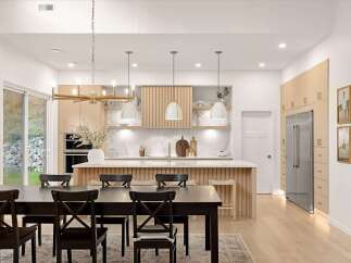 Experience modern living in this stunning open-concept kitchen and dining area, featuring a sleek island with waterfall countertops and ample natural light.