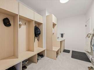 Discover this spacious mudroom, perfect for keeping your home organized and tidy.
