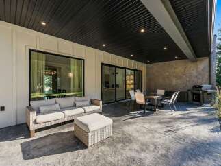 Enjoy seamless indoor-outdoor living with this expansive covered patio, perfect for entertaining.