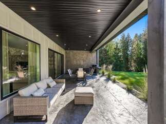 Enjoy seamless indoor-outdoor living with this spacious covered patio, perfect for entertaining.