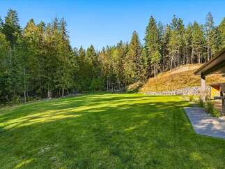 Experience the perfect blend of nature and modern living with this expansive, sun-drenched lawn, ideal for outdoor recreation and entertaining.