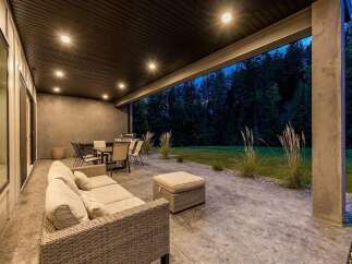 Enjoy outdoor living with this spacious covered patio, perfect for entertaining or relaxing evenings.