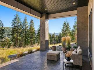 Enjoy breathtaking mountain views from this covered patio, perfect for outdoor living and entertaining.
