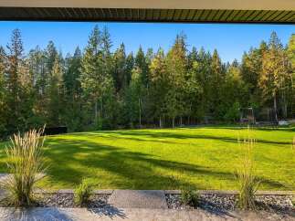 Experience the ultimate outdoor living with this expansive, beautifully manicured lawn, perfect for recreation and relaxation.