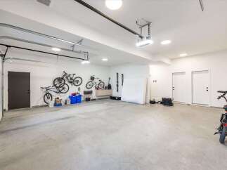 This spacious garage offers ample storage and organization solutions, perfect for any homeowner.