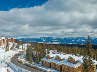 Experience the ultimate mountain lifestyle with this stunning ski-in/ski-out property, offering breathtaking views of snow-capped peaks and lush evergreen forests.