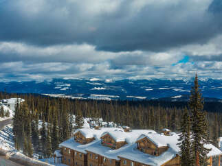 Experience breathtaking mountain views from this stunning ski resort property, perfect for winter enthusiasts.