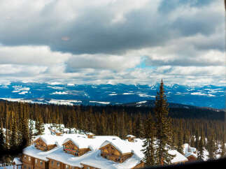 Experience the ultimate mountain getaway with this stunning property offering breathtaking panoramic views of snow-capped peaks and lush evergreen forests.