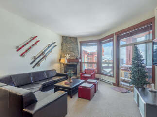 Experience ultimate comfort in this spacious living room, featuring a large sectional sofa perfect for gatherings.