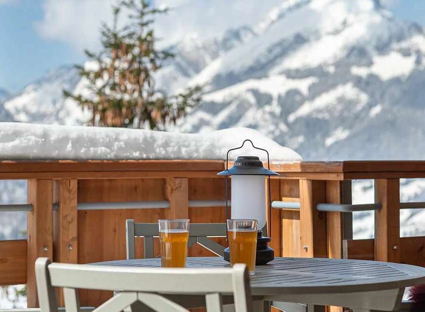 Enjoy breathtaking mountain views from this charming balcony, perfect for a relaxing getaway.