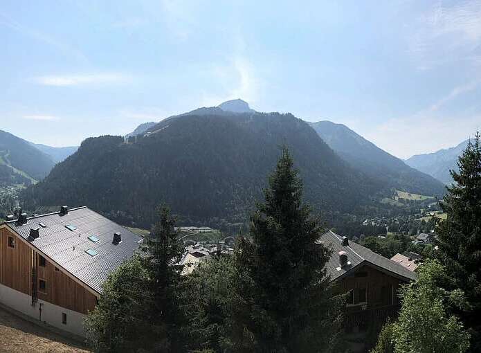 Experience breathtaking mountain views from this stunning property, featuring modern architecture and ample balconies perfect for enjoying the alpine scenery.