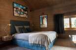 Experience rustic charm and modern comfort in this beautifully appointed bedroom.