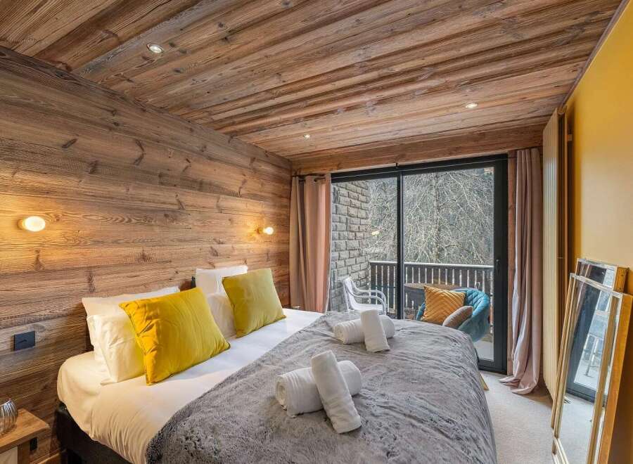 Experience rustic charm and modern comfort in this beautifully appointed bedroom.