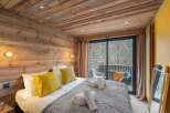 Experience rustic charm and modern comfort in this beautifully appointed bedroom.